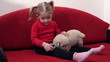 little girl feed pet dog
