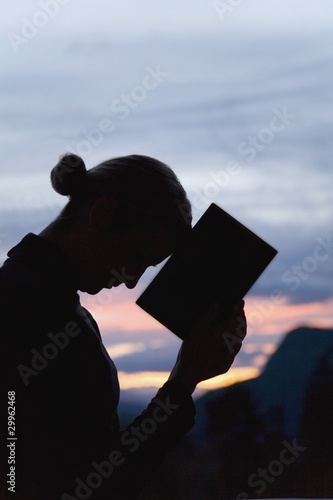 Photo: Silhouette Of Woman With A Book Silhouette Of Woman With A Book