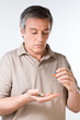 Elder man taking pills