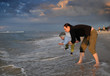 Mother and son playing at the beach