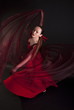 woman dancer in red dress with veil