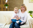 Photo: little boy and his mother at home together little boy and his mother at home together