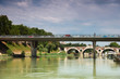 cars go over bridge on Tiber River, away bridge Trastevere