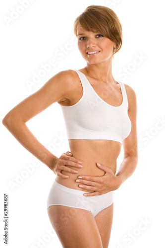 Photo: Young woman touching stomach Young woman touching stomach