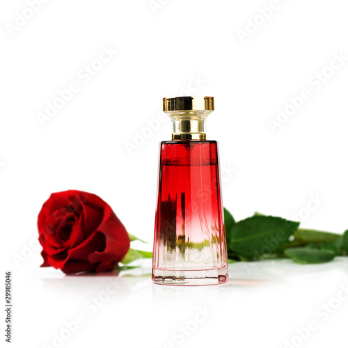 Photo: Perfume and rose on white Perfume and rose on white