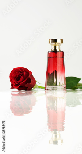 Photo: Red rose and Perfume bottle Red rose and Perfume bottle