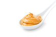 Creamy peanut butter in a white spoon Creamy peanut butter in a white spoon