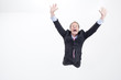 Enthusiastic businessman raising his arms