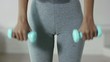 Video: Woman exercising with small weights in gym Woman exercising with small weights in gym