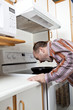 Man with anger management issues yelling at frying pan
