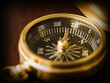 Brass Compass on an old cherrywood table