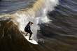 Surfer gets up on a wave.