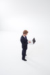 Standing businessman using laptop