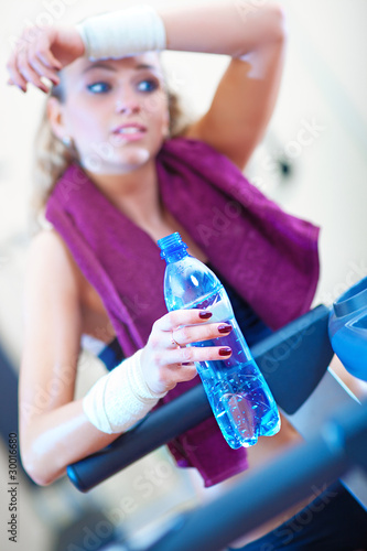 Photo: Young woman resting after training Young woman resting after training