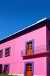 Mexican pink house facade wooden doors Mexican pink house facade wooden doors