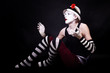 Dramatic funny mime in white hat
