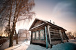 Old village house in the rays of evening sun