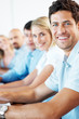 Group of businesspeople sitting together in a seminar Group of businesspeople sitting together in a seminar
