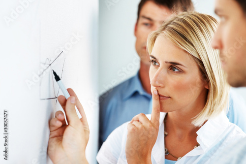 Photo: Business people in a meeting at office - Group discussion Business people in a meeting at office - Group discussion