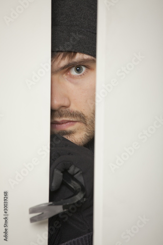 Photo: Burglar with crowbar Burglar with crowbar