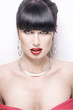 Fashion woman with jewelry on light bacground Fashion woman with jewelry on light bacground