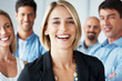 Cute businesswoman smiling with her business group