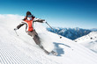 Woman skiing in high mountains - modified piste