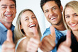 Successful business team with thumbs up
