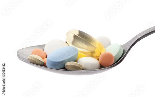 Photo: Pills on spoon with clipping path Pills on spoon with clipping path
