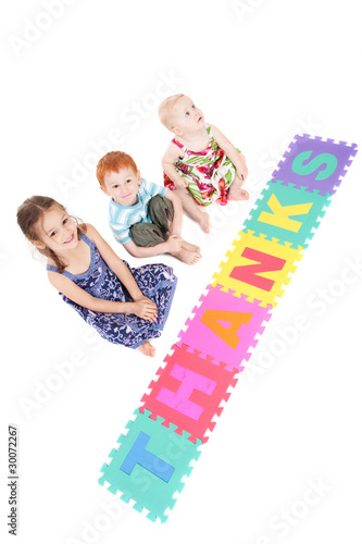 Photo: Three kids with thanks sign Three kids with thanks sign