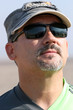 Middle-age man in sunglasses after flight on a paraglider