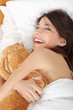 Girl in bed with teddy bear Girl in bed with teddy bear