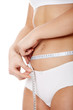 Female measuring her body