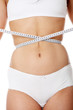 Female measuring her body