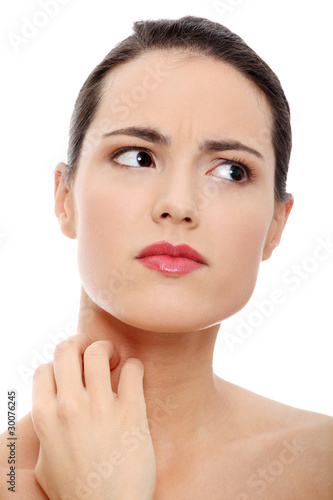 Photo: Young beautiful woman scraching her self Young beautiful woman scraching her self