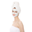 Cosmetics mask of clay on the beautiful young woman face