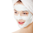 Cosmetics mask of clay on the beautiful young woman face