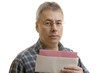 Shocked man reading layoff notice Shocked man reading layoff notice