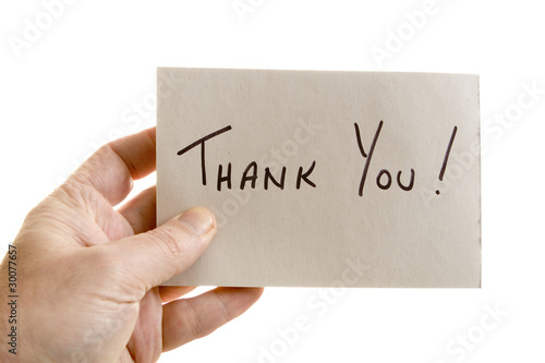 Photo: Hand holdins a thank you note Hand holdins a thank you note