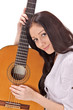 Young beautiful smiling brunette lady with acoustic guitar
