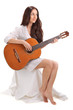 Young beautiful brunette lady playing acoustic guitar