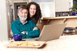 Father and daughter using laptop