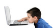 Photo: Cute child working on computer isolated on white background. Cute child working on computer isolated on white background.