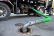 Photo: Fuel delivery tanker truck filling up storage tank Fuel delivery tanker truck filling up storage tank