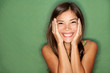 Surprised happy woman on green background Surprised happy woman on green background