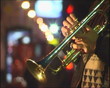 Close-up trumpet with reflection of lights.