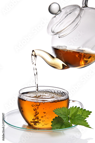 Photo: Tea poured cup (clipping path) Tea poured cup (clipping path)