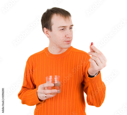 Photo: young man with pills in hand young man with pills in hand