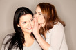 Foto: beautiful brunette whispering beautiful brunette whispering