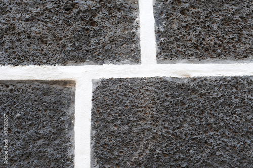 Photo: Dark volcanic bricks with white cement joints, pattern Dark volcanic bricks with white cement joints, pattern